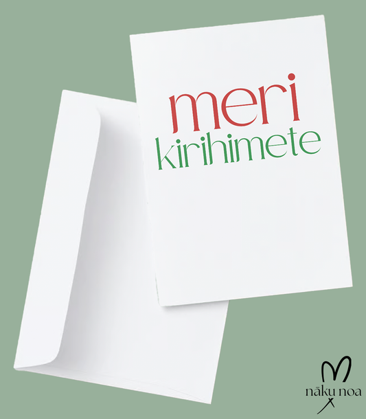 Te Reo Māori Christmas card in white, reads Meri Kirihimete on the front in red and green font. It is presented with a white envelope.